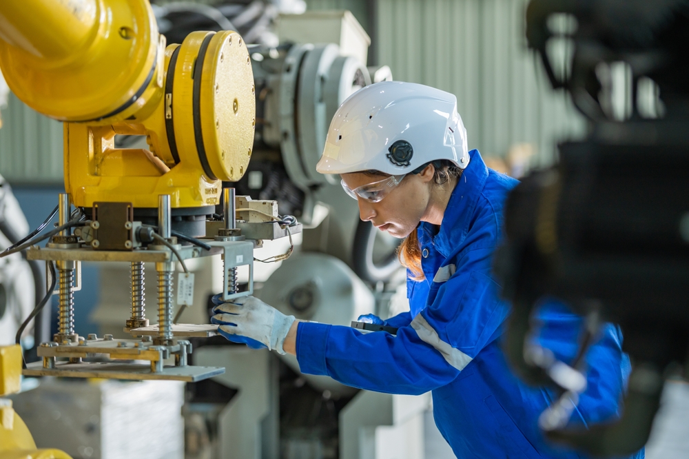 engineer inspecting automation machine